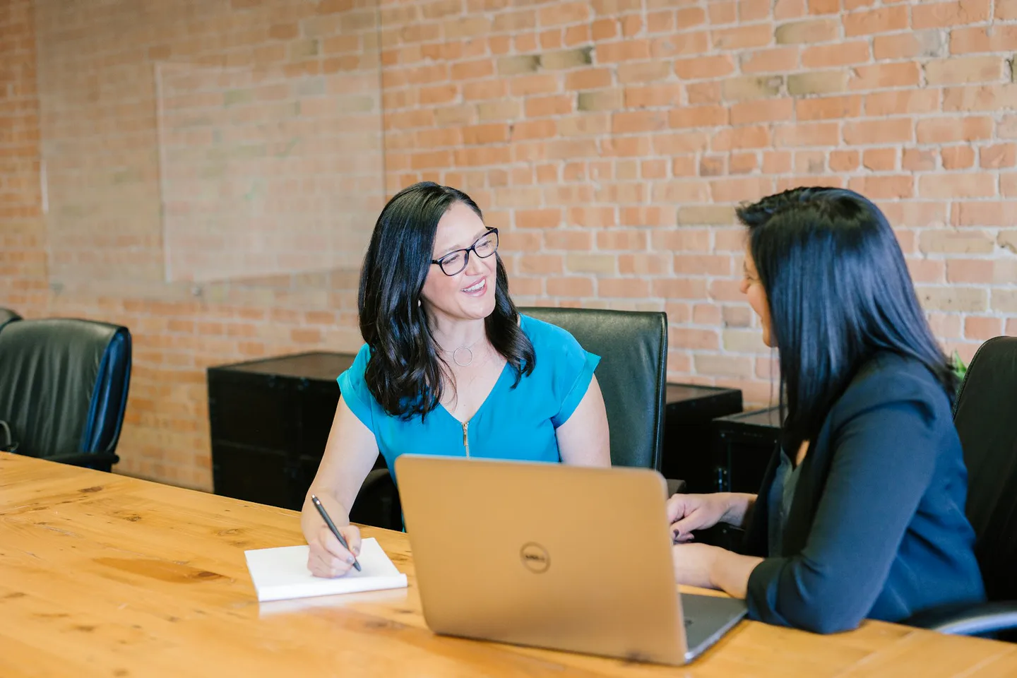 Business owners discussing a confidential submission